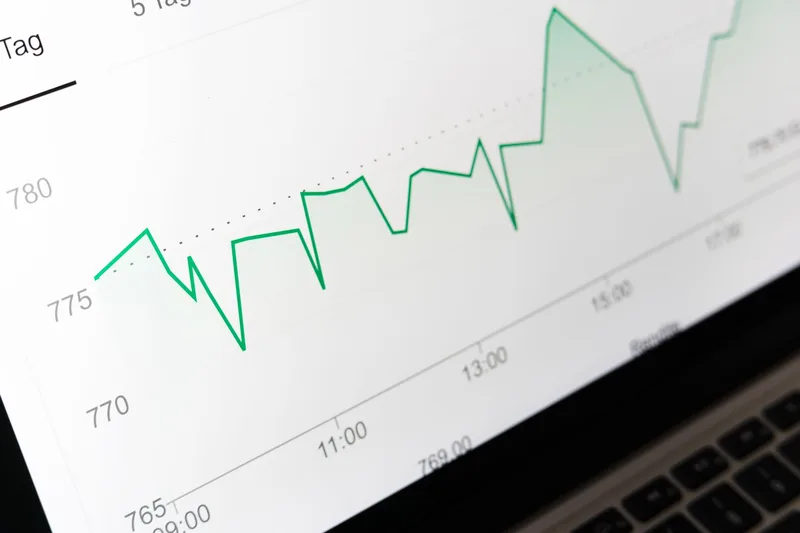 Close-up of a financial data chart on a laptop screen, representing the formula-driven calculations behind an Excel inventory tracking system for ecommerce