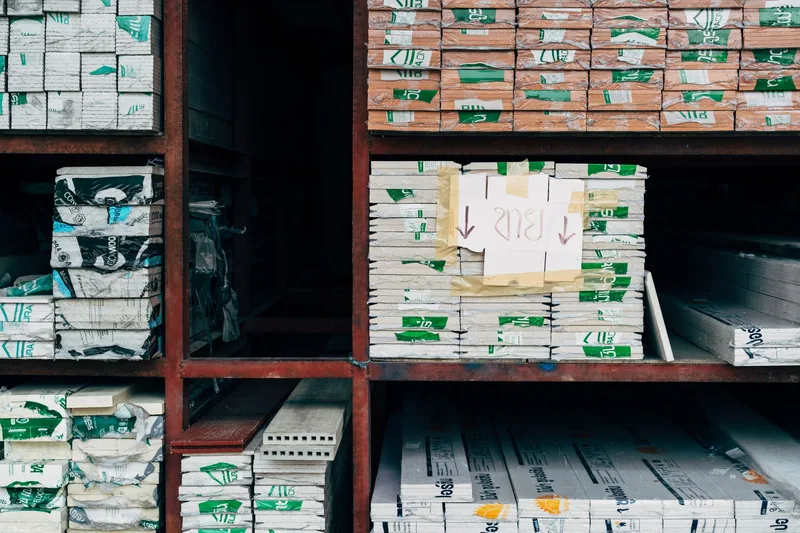 Warehouse shelving stacked with received stock, the kind of goods receipt a purchase order gets checked against